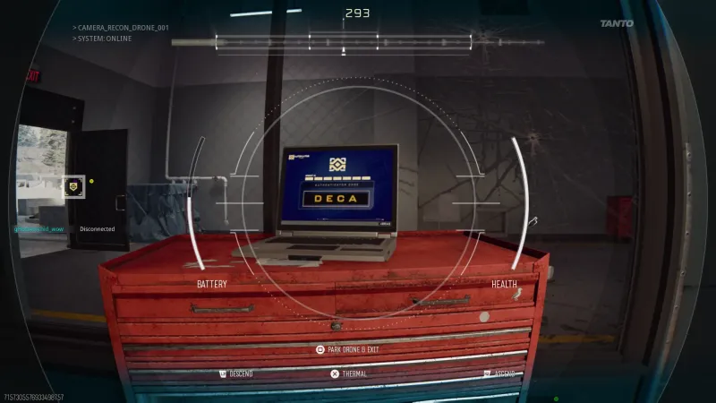 Drone camera view of the garage laptop showing a four-letter authenticator code