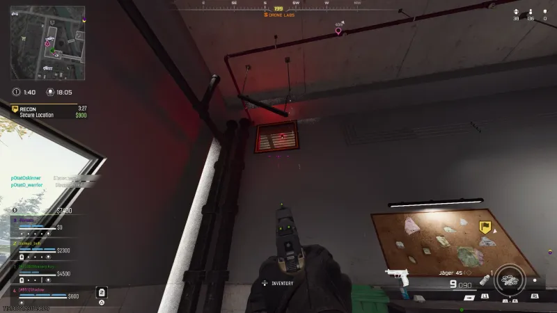 First person view aiming a pistol at the vent grate inside Drone Labs