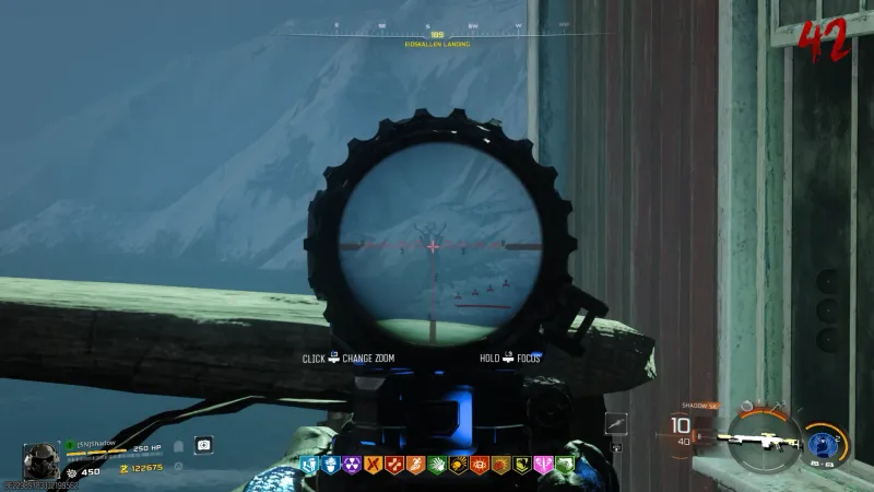 Sniper scope view from Borealis Landing showing a deer skull totem target on a distant mountain in Totenreich