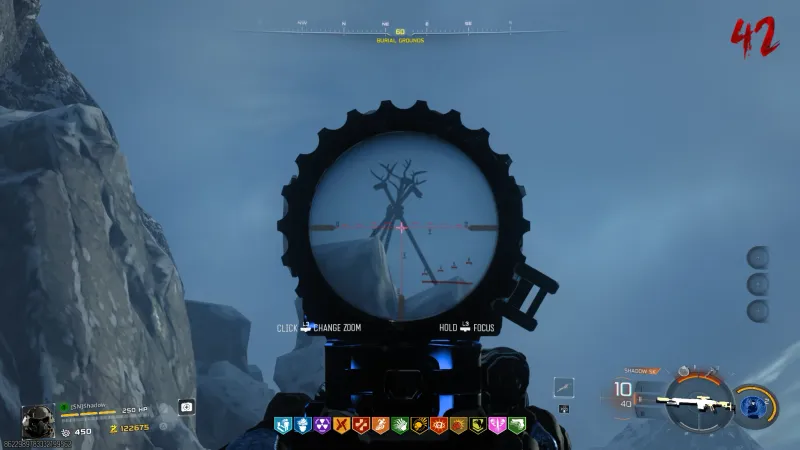 Sniper scope view from Burial Grounds showing a deer skull totem target shaped like a dead tree in Totenreich