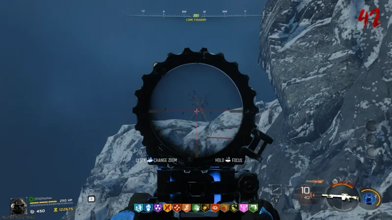Sniper scope view from Long Meadow showing a deer skull totem target on a snowy ridgeline in Totenreich