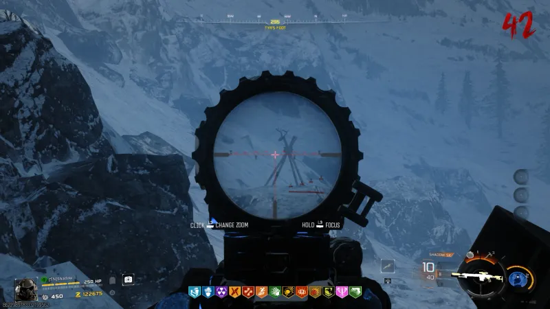 Sniper scope view from The Fort showing a deer skull totem target shaped like a wooden cross in Totenreich